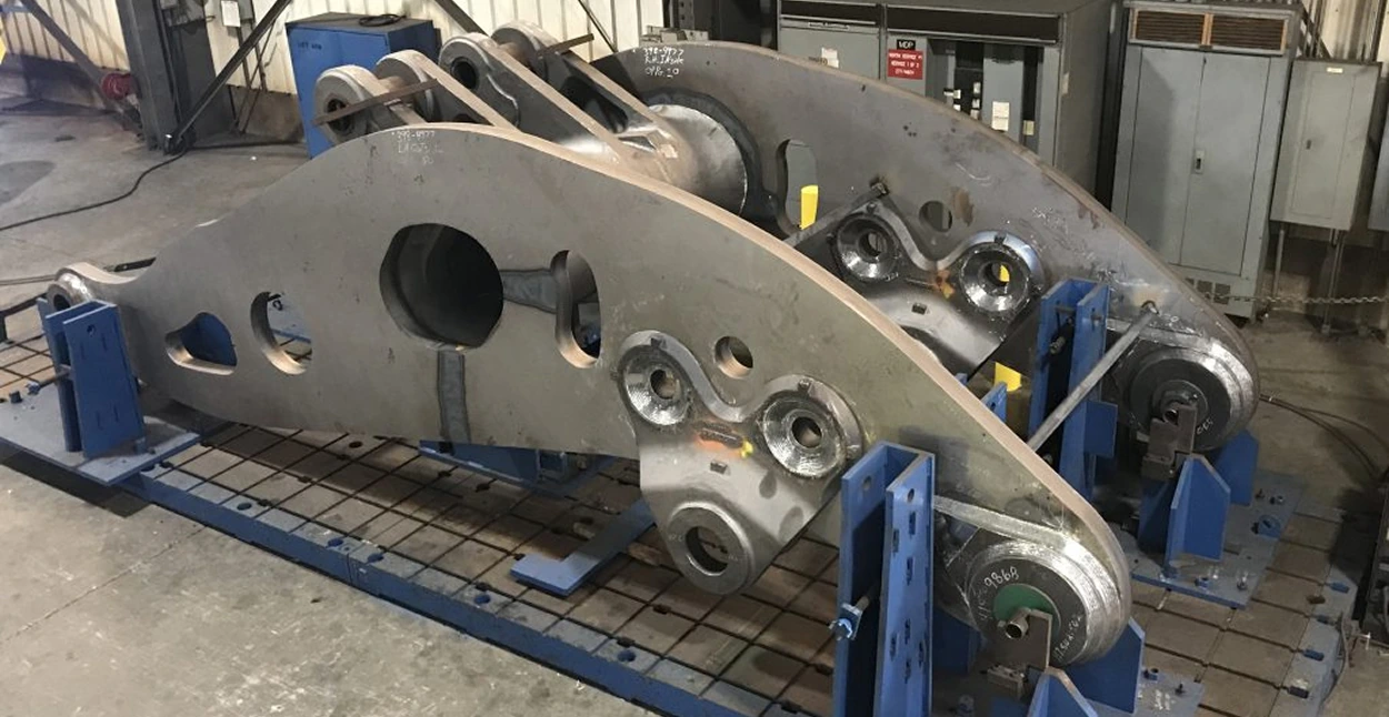 A large machined and welded piece of a heavy machine.
