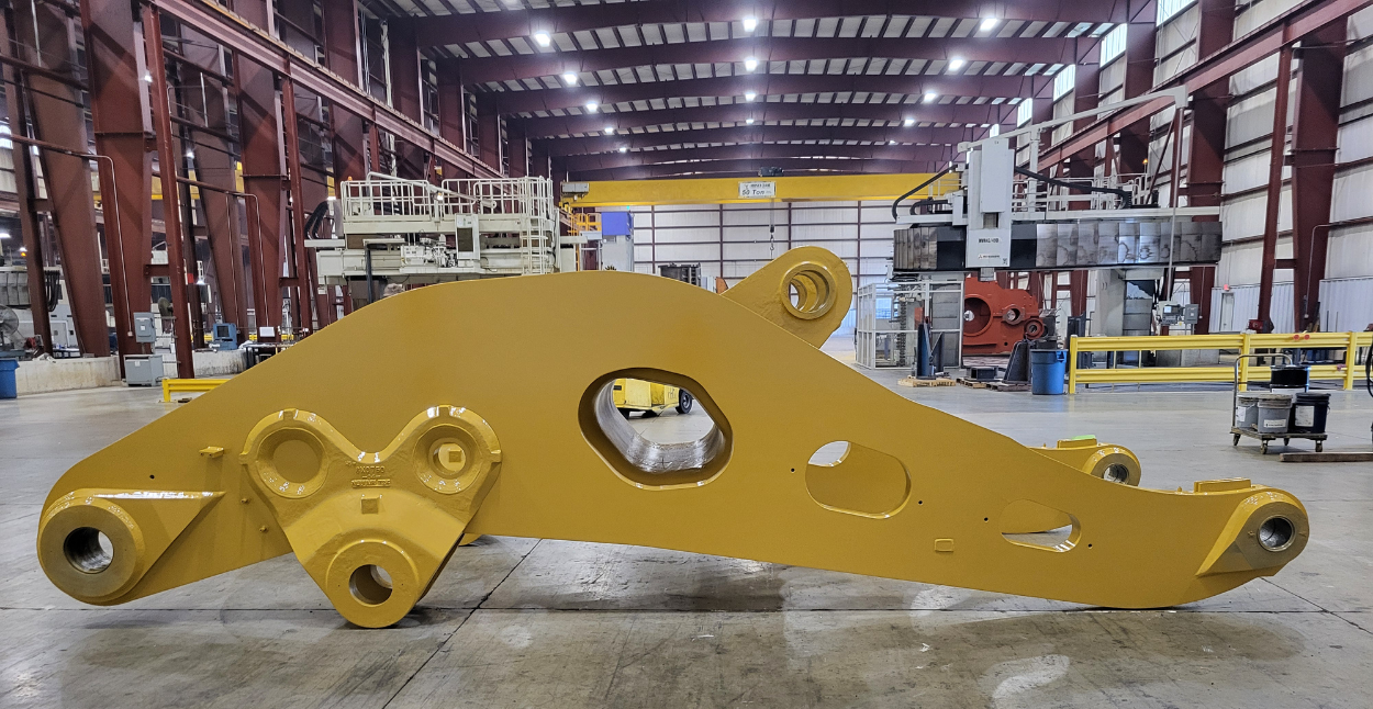 A crane cab sitting on jacks during the assembly process